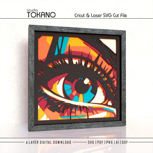 Angled view of the Eye layered SVG shadow box showing bold iris detail, stacked cardstock layers, and dimensional 3D depth.