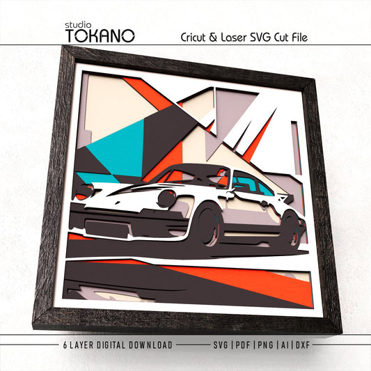 Finished Porsche 911 layered papercut design shown as framed car wall art for garage decor, man cave decor, and automotive crafts.