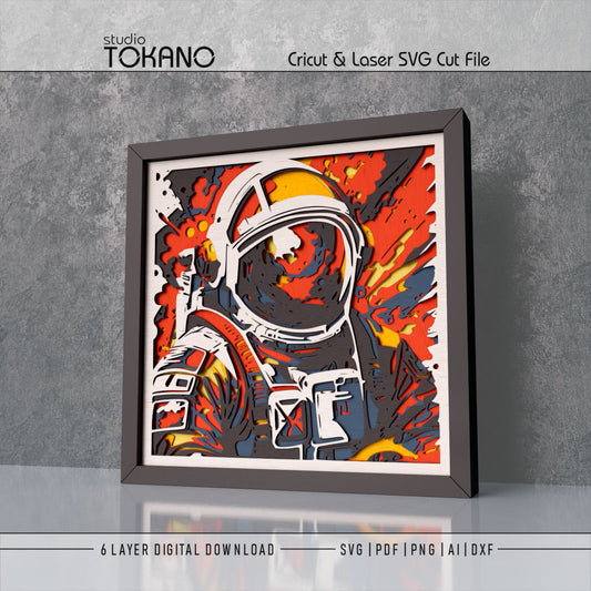 Astronaut shadow box SVG shown as sci-fi wall decor for Cricut, Silhouette, Glowforge, and xTool projects.