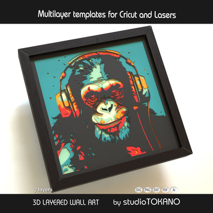 Close-up of the chimp shadow box cut file showing clean layered cardstock detail, headphone shapes, and crisp papercut lines.