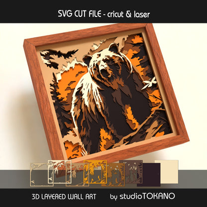 Grizzly bear shadow box SVG shown as finished 3D layered papercut wall art with a realistic forest wildlife theme for Cricut and laser cutting.