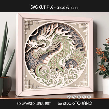 Decorative Asian dragon shadow box design shown in a white frame with clean cardstock layers and a polished finished look.