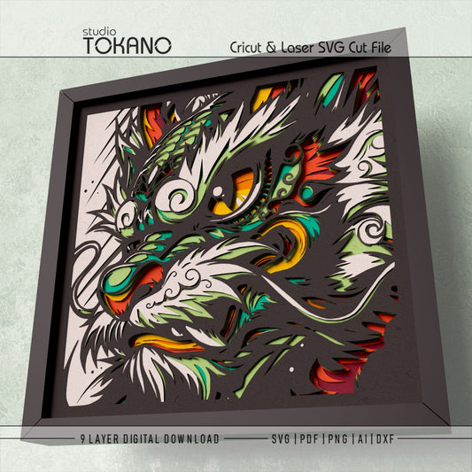 Close-up of the dragon layered SVG design showing sharp facial details, fiery color accents, and 9-layer construction.