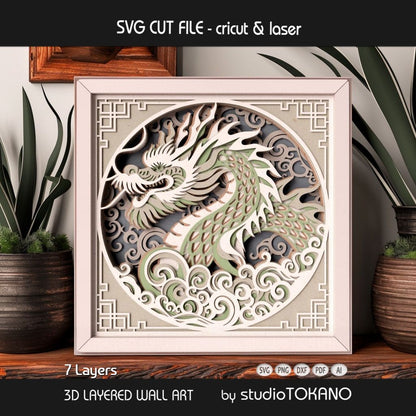 Dragon layered SVG cut file shown as framed papercut wall art with a bold dragon head, swirling clouds, and strong 3D depth.