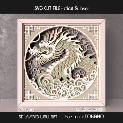 Close-up of the dragon shadow box design showing detailed scales, flowing cloud shapes, and stacked 7-layer cardstock depth.