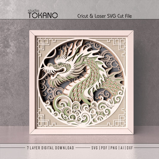 Dragon shadow box SVG shown as a 3D layered cardstock design for Cricut, Silhouette, and laser cutting paper projects.