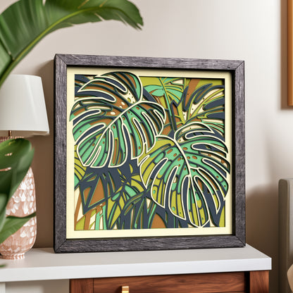 Framed Monstera leaf shadow box displayed as tropical botanical wall decor
