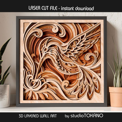 Hummingbird laser cut file shown as finished multilayer wood wall art with flowing botanical shapes, floral detail, and natural layered depth.