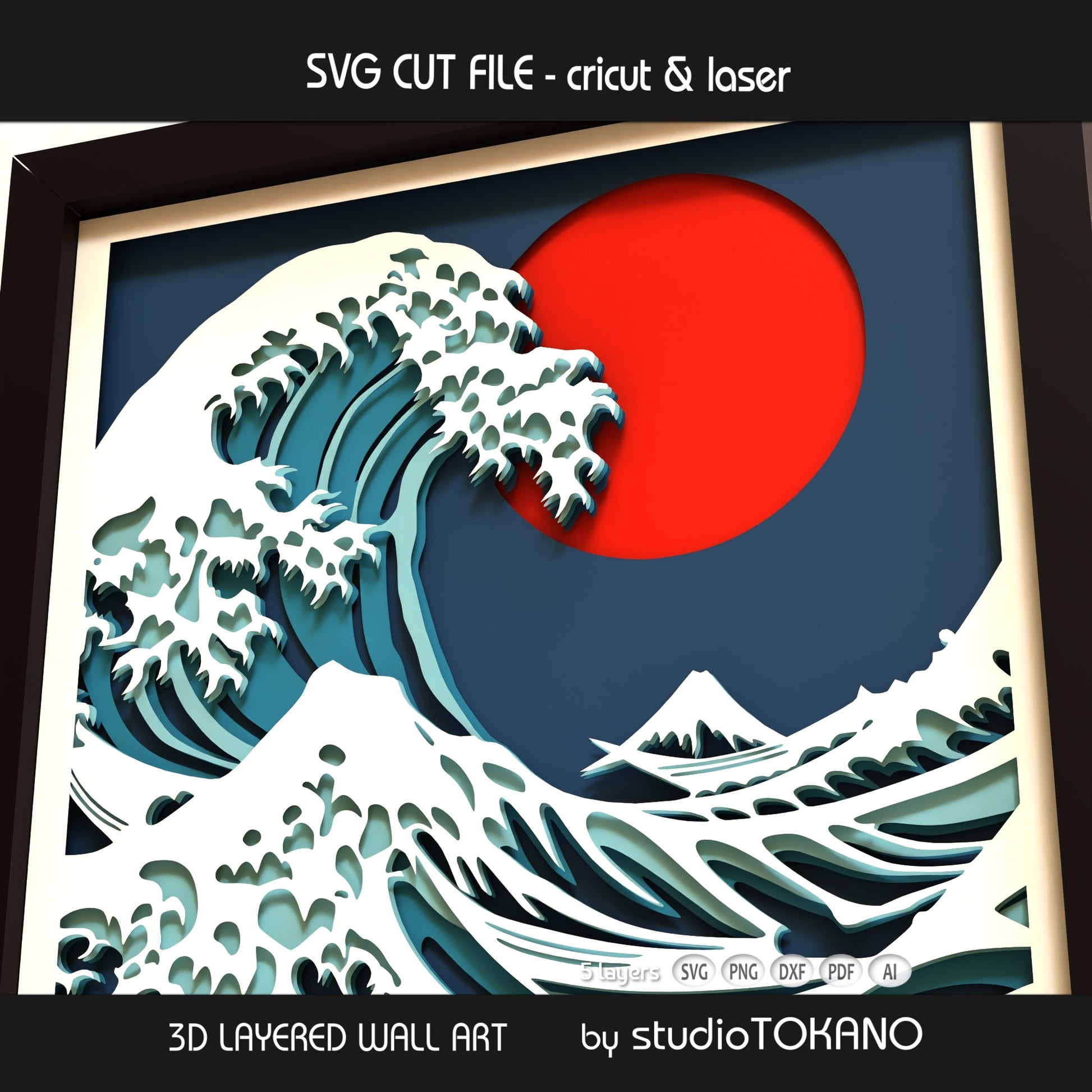 Japanese wave papercut wall art displayed in a shadow box frame as bold coastal decor and handmade ocean-inspired craft art.