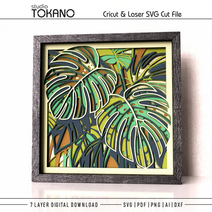 Colorful layered Monstera leaves arranged in a detailed tropical jungle papercut design
