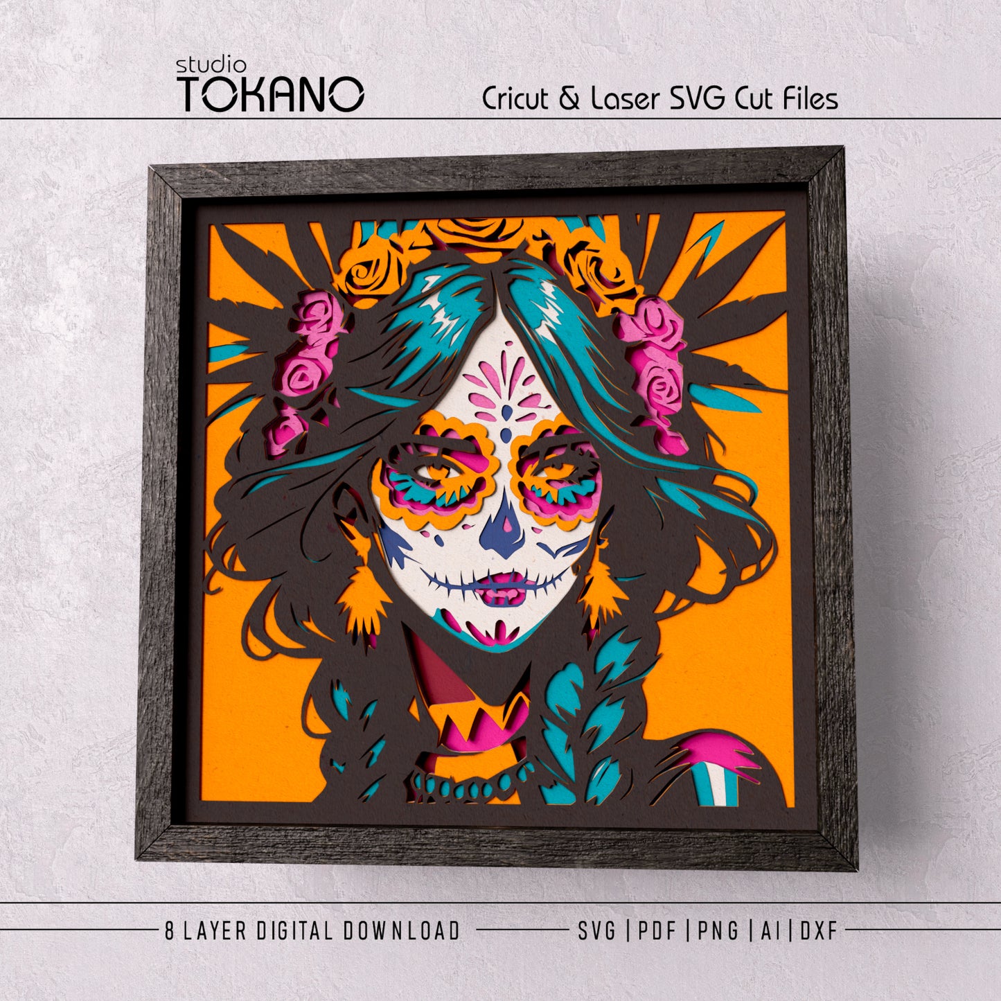 Mexican-inspired sugar skull girl layered paper art displayed in a black frame with vivid colors and a polished finished look.