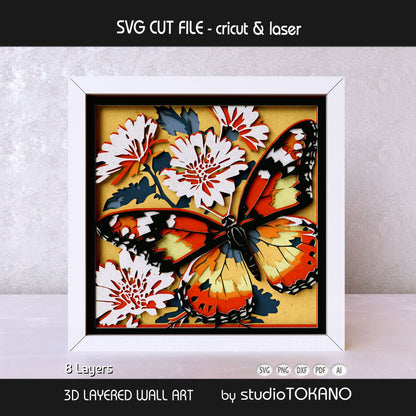 Monarch butterfly papercut wall art displayed in a shadow box frame with dimensional 3D layered cardstock construction.