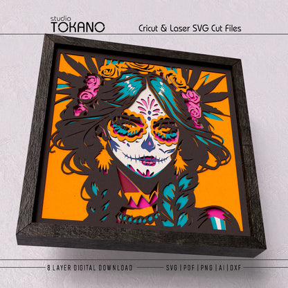 Close-up of the Sugar Skull Girl shadow box design showing bright floral accents, detailed face shapes, and clean layered cut lines.