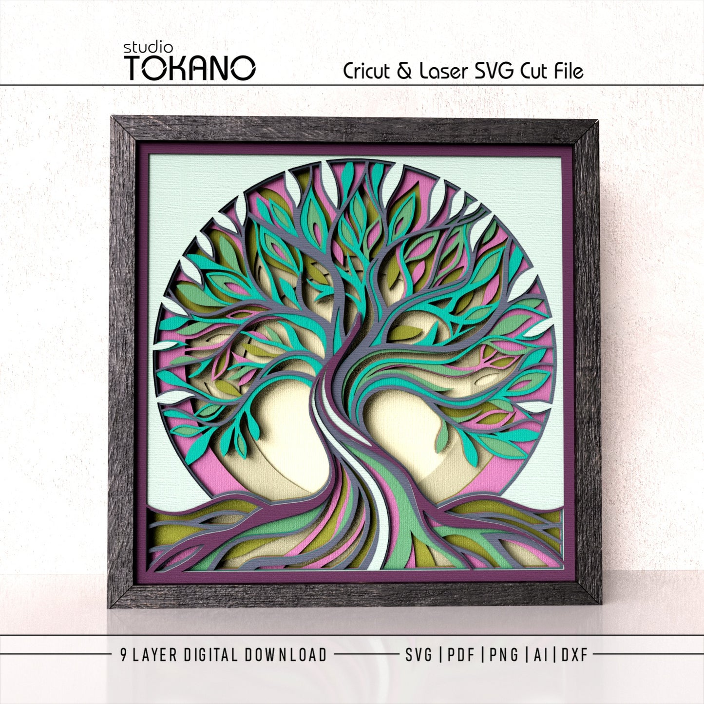 A framed layered tree-of-life wall art design shown on a light textured background, with text at the top reading 'studio TOKANO' and 'Cricut & Laser SVG Cut File,' plus '9 LAYER DIGITAL DOWNLOAD' and file formats at the bottom. The artwork features teal, pink, purple, olive green, cream, and gray layered branches and leaves inside a dark wood frame.