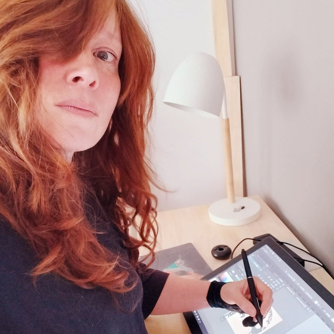 Ulla designing an original layered SVG file on her drawing tablet at Studio Tokano.